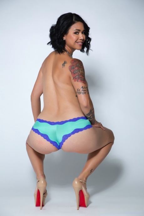 Sexy Asian MILF Dana Vespoli strips to her heels & displays her hot inked body