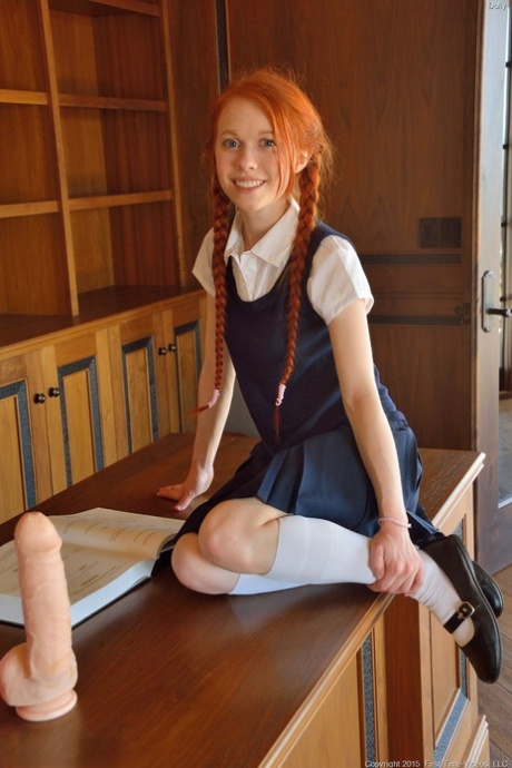Ginger schoolgirl Dolly inserts a huge fake cock & Ben Wa balls into her pussy