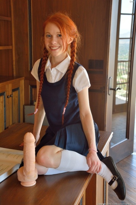 Ginger schoolgirl Dolly inserts a huge fake cock & Ben Wa balls into her pussy