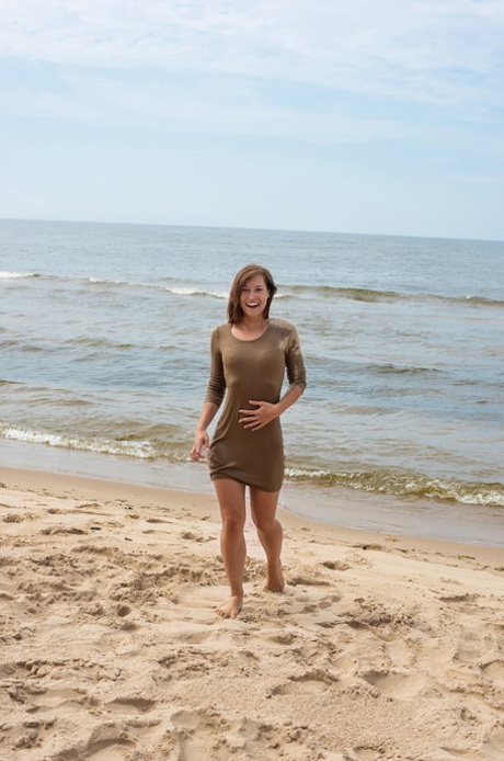 Charming amateur teen Mina poses nude on the beach & exposes her sizzling body
