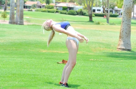 Delightful teen jogger Summer reveals her fine figure and poses in the park