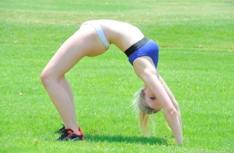 Delightful teen jogger Summer reveals her fine figure and poses in the park