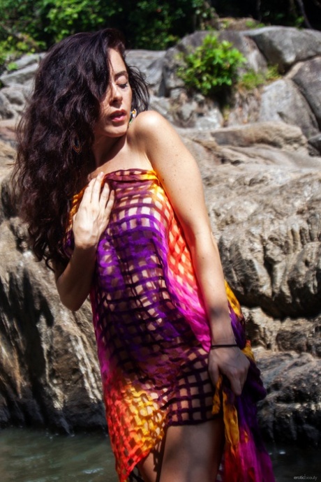 Fine brunette lady Madivya reveals her stunning boobs in the river