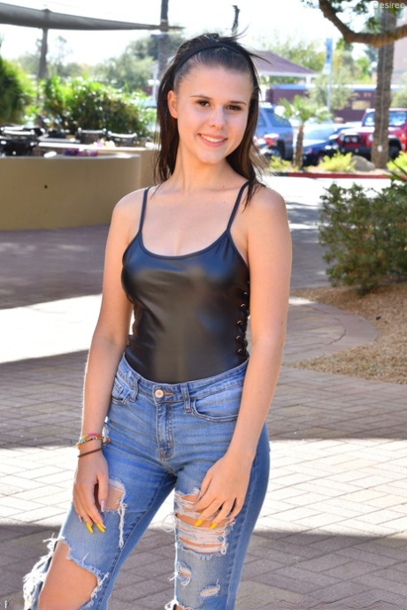 Sexy babe in ripped jeans Desiree exposing & massaging her teen tits in public