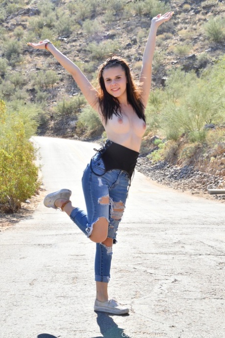 Sexy babe in ripped jeans Desiree exposing & massaging her teen tits in public